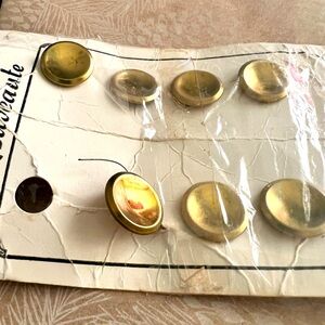 seven gold brass buttons